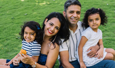 Small-Happy-Family-Enjoying-In-Garden