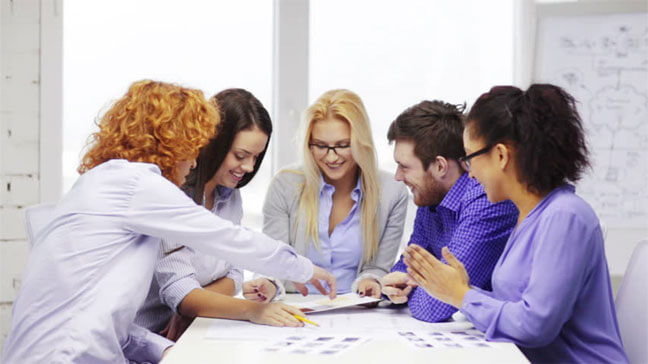 Girls-Boys-Team-Discussing-Office-Work